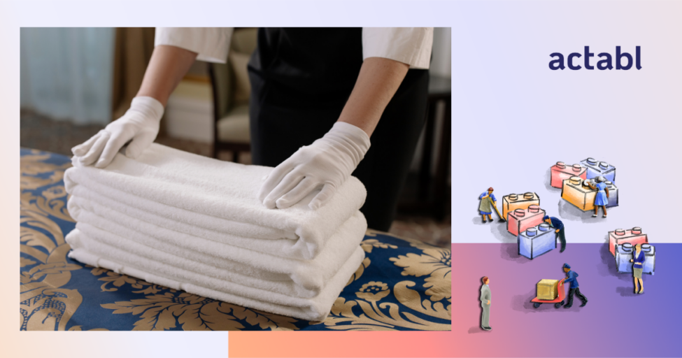 Photo of housekeeper folding towels